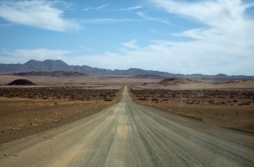 Endless gravel road, mountains, desert, Namibia