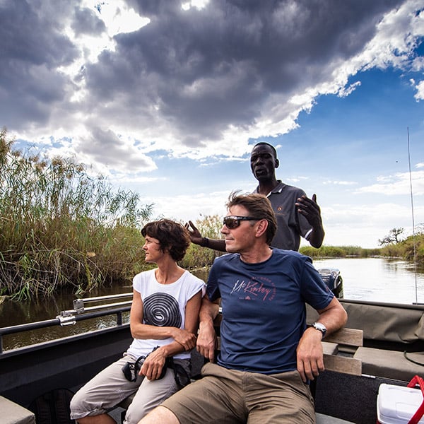 Boat with guide and tourists, river, Namibia