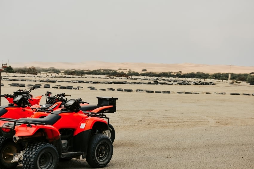 Quad biking across the sand dunes near Swakopmund, Namibia