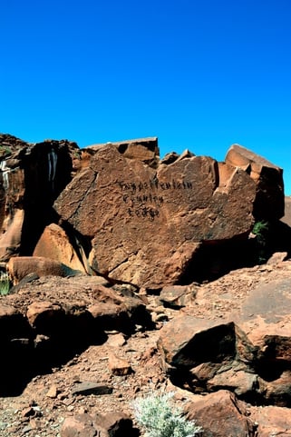 Ancient rock art surrounded by the landscape of Damaraland, Namibia