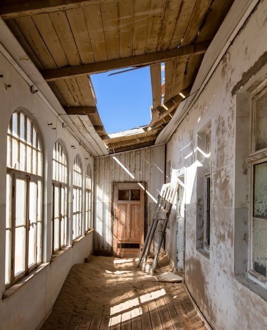 Hallway of abandoned house at Kolmanskop. 