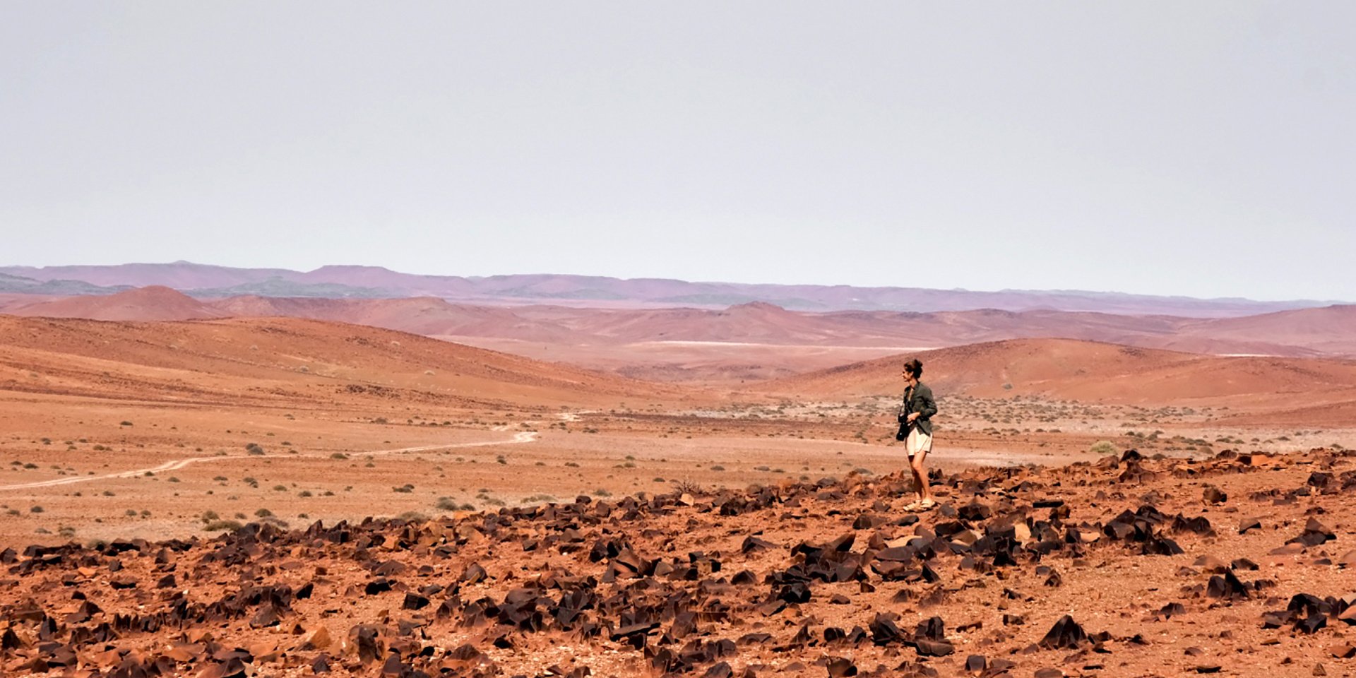 Women overlooking vast Namibian landscape 