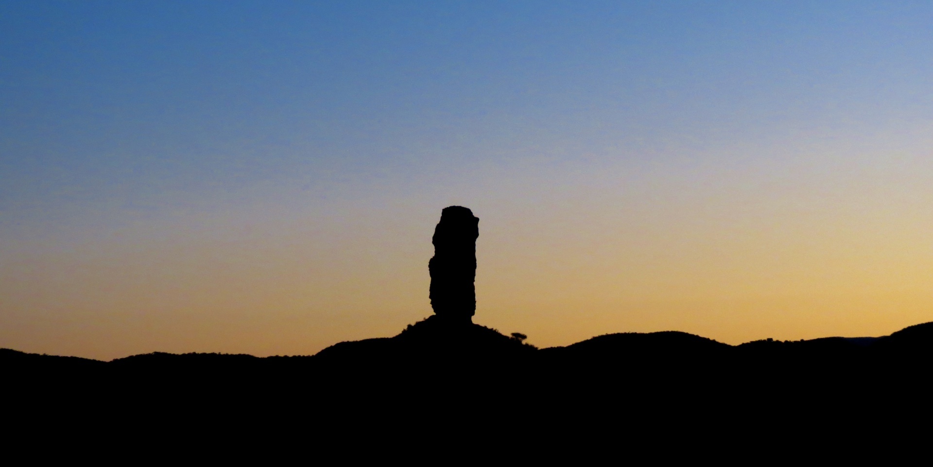 Vingerklip rock formation rising dramatically above the Ugab Terrace landscape near Outjo, Namibia.