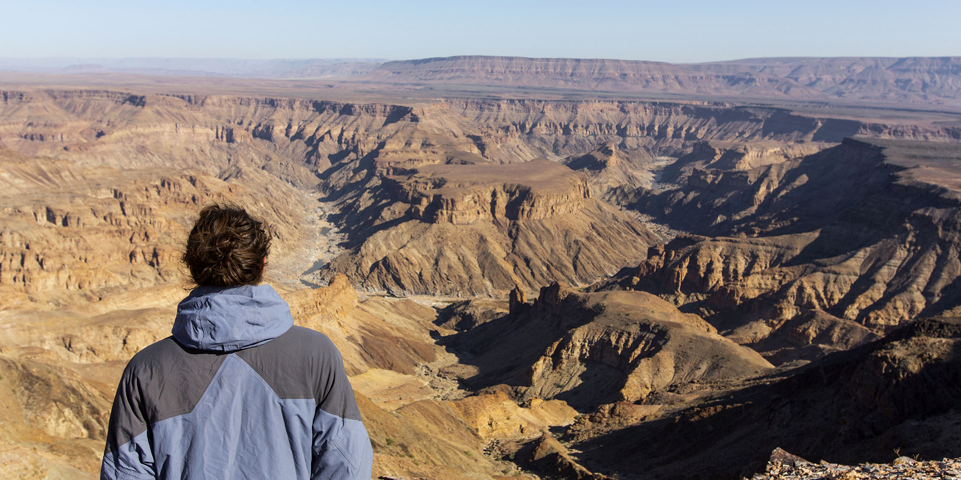Man overlooking Fish River Canyon, Namibia