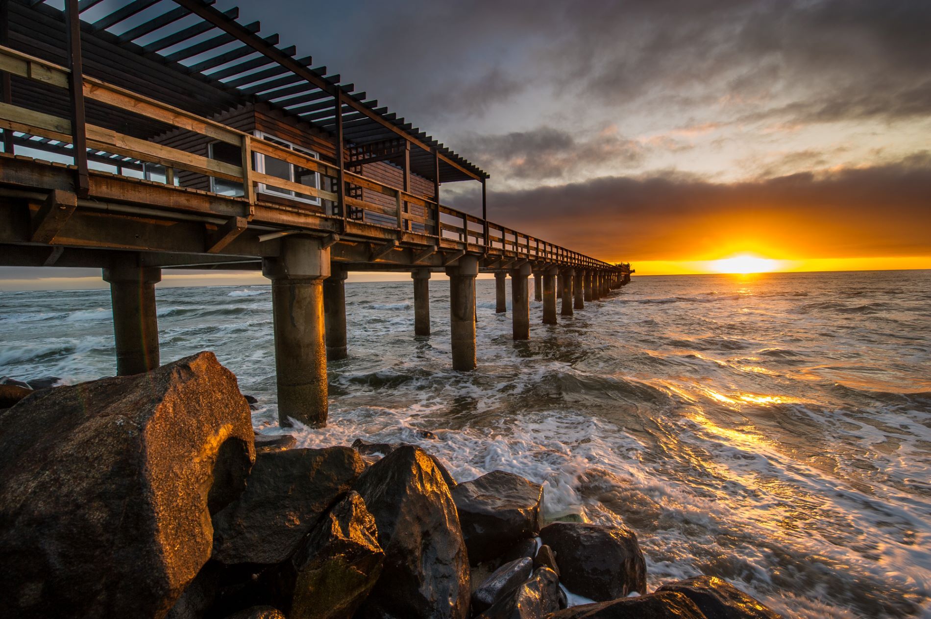 Golden sunset over the Atlantic ocean in the coastal town of Swakopmund, Namibia. 